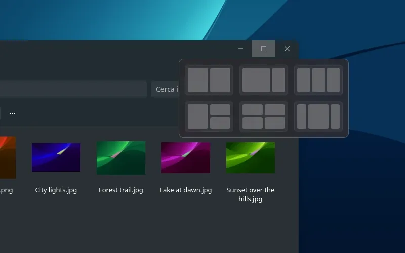 Close-up of the snap layouts flyout under a window's maximize button, offering six arrangements.